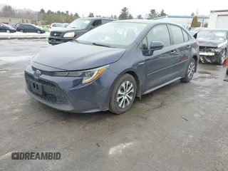 2021 Toyota Corolla Hybrid LE with VIN JTDEAMDE2MJ030035, listed as a IAAI auction lot 41644662 with 130,693 mi miles. Bid and sale history available at carsss.com. Image 2.