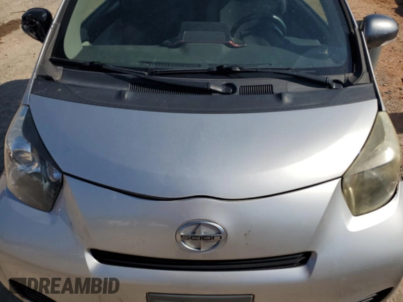 2012 Scion iQ with VIN JTNJJXB05CJ010539, listed as a Copart auction lot 56489245 with 114,623 mi miles and Salvage title. Bid and sale history available at DreamBid. Image 11.