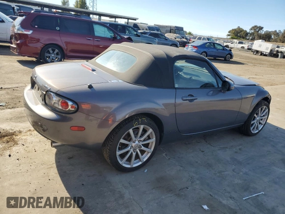 2006 Mazda MX-5 Miata Sport z VIN JM1NC25F260115830, wystawiony jako Copart lot #76844774 z przebiegiem 52 599 mil mil oraz Szkoda całkowita • Salvage title. Historia ofert i sprzedaży dostępna na DreamBid. Obrazek 3.