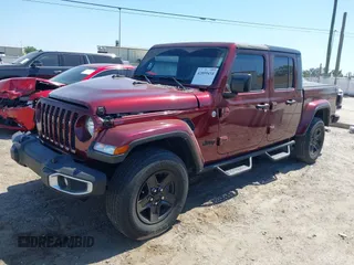 2021 Jeep Gladiator Freedom with VIN 1C6HJTAG2ML549434, listed as a IAAI auction lot 42059434 with 29,041 mi miles and . Bid and sale history available at DreamBid. Image 2.