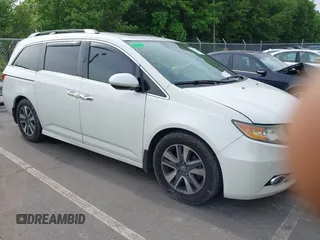 2015 Honda Odyssey Touring Elite z VIN 5FNRL5H90FB016806, wystawiony jako IAAI lot #42289177 z przebiegiem 172 251 mil mil oraz . Historia ofert i sprzedaży dostępna na DreamBid. Obrazek 1.