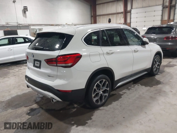 2021 BMW X1 xDrive28i with VIN WBXJG9C04M5T82884, listed as a IAAI auction lot 42242890 with 24,647 mi miles and . Bid and sale history available at DreamBid. Image 4.