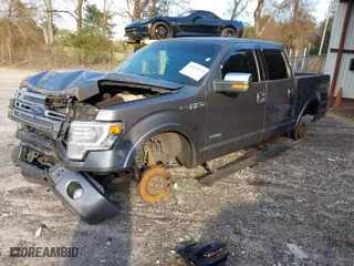 2014 Ford F-150 XL with VIN 1FTFW1ETXEFC17464, listed as a IAAI auction lot 41014879 with 150,129 mi miles. Bid and sale history available at carsss.com. Image 2.