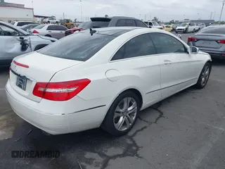 2010 Mercedes-Benz E with VIN WDDKJ5GB0AF005357, listed as a IAAI auction lot 42020474 with 133,117 mi miles. Bid and sale history available at carsss.com. Image 4.