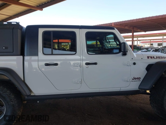 2022 Jeep Gladiator Rubicon with VIN 1C6JJTBM6NL145009, listed as a IAAI auction lot 42134143 with 59,438 mi miles and . Bid and sale history available at DreamBid. Image 13.