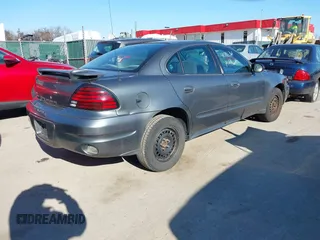 2004 Pontiac Grand Am SE with VIN 1G2NE52F54M560234, listed as a IAAI auction lot 41716361 with 256,571 mi miles. Bid and sale history available at carsss.com. Image 4.