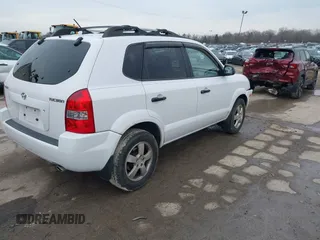 2006 Hyundai Tucson GL with VIN KM8JM12BX6U467288, listed as a IAAI auction lot 41679827 with 146,973 mi miles. Bid and sale history available at carsss.com. Image 4.