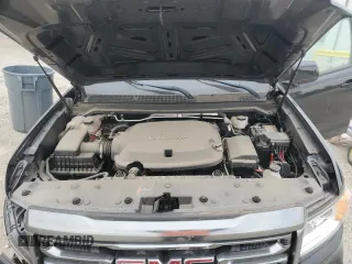 2021 GMC Canyon 4WD AT4 z VIN 1GTG6FEN9M1192443, wystawiony jako Copart lot #54955745 z przebiegiem 1544 mil mil oraz Tytuł czysty. Historia ofert i sprzedaży dostępna na DreamBid. Obrazek 11.