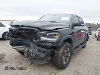 2019 Ram 1500 Rebel z VIN 1C6SRFLT1KN722064, wystawiony jako IAAI lot #41513201 z przebiegiem 113 559 mil mil oraz . Historia ofert i sprzedaży dostępna na DreamBid. Obrazek 2.