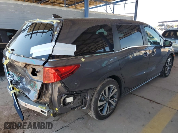 2021 Honda Odyssey Touring with VIN 5FNRL6H88MB040703, listed as a Copart auction lot 60340095 with 66,171 mi miles and Salvage title. Bid and sale history available at DreamBid. Image 3.