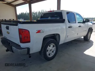 2013 Chevrolet Silverado 1500 LT with VIN 3GCPKSE71DG358722, listed as a IAAI auction lot 42128592 with 206,779 mi miles and . Bid and sale history available at DreamBid. Image 4.