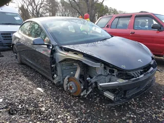 2023 Tesla Model 3 with VIN 5YJ3E1EAXPF666252, listed as a IAAI auction lot 42009929 with 27,328 mi miles and . Bid and sale history available at DreamBid. Image 1.