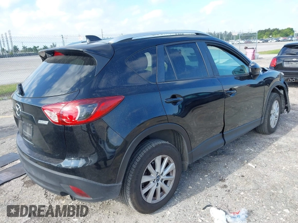 2014 Mazda CX-5 Touring with VIN JM3KE2CYXE0384987, listed as a IAAI auction lot 42052196 with 151,765 mi miles. Bid and sale history available at carsss.com. Image 4.