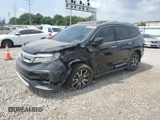 2021 Honda Pilot Touring 8-Passenger with VIN 5FNYF5H96MB039975, listed as a Copart auction lot 62074585 with 101,404 mi miles and Salvage title. Bid and sale history available at DreamBid. Image 1.