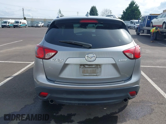 2014 Mazda CX-5 Grand Touring with VIN JM3KE4DY9E0375014, listed as a IAAI auction lot 42000382 with 110,584 mi miles and . Bid and sale history available at DreamBid. Image 17.