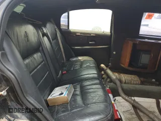 1999 Lincoln Town Car Executive with VIN 1L1FM81W8XY710157, listed as a Copart auction lot 59804965 with Not provided miles and Salvage title. Bid and sale history available at DreamBid. Image 10.