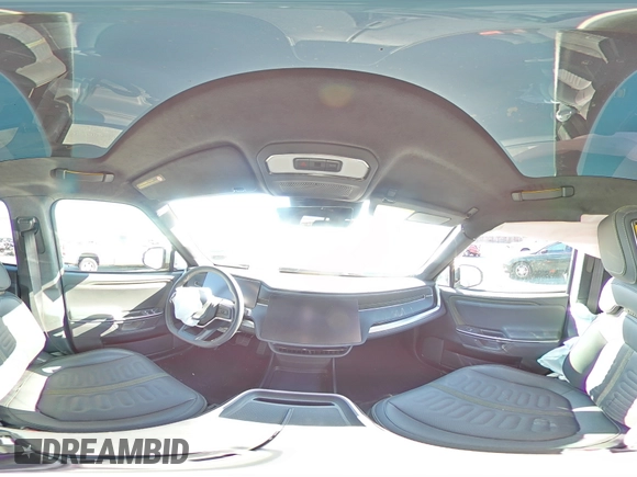 2025 Rivian R1S Adventure z VIN 7PDSGBBA5SN048839, wystawiony jako Copart lot #89199375 z przebiegiem 5177 mil mil oraz Szkody całkowita. Historia ofert i sprzedaży dostępna na DreamBid. Obrazek 13.