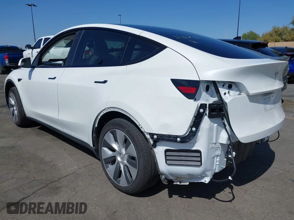 2023 Tesla Model Y Long Range with VIN 7SAYGDEE2PF632121, listed as a IAAI auction lot 41798780 with 53,773 mi miles. Bid and sale history available at carsss.com. Image 3.