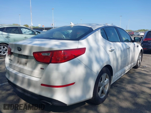 2015 Kia Optima LX with VIN KNAGM4A76F5663782, listed as a IAAI auction lot 42162942 with 128,321 mi miles. Bid and sale history available at carsss.com. Image 4.