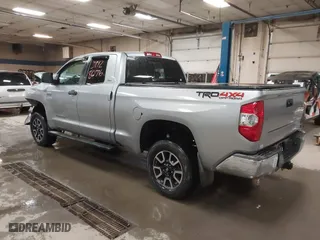 2014 Toyota Tundra 4WD Truck SR with VIN 5TFUY5F17EX357035, listed as a IAAI auction lot 39928076 with 129,831 mi miles. Bid and sale history available at carsss.com. Image 3.