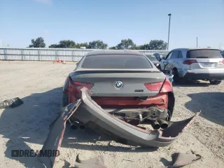 2015 BMW M6 z VIN WBS6C9C52FD467461, wystawiony jako Copart lot #68057084 z przebiegiem 130 687 mil mil oraz Szkoda całkowita • Salvage title. Historia ofert i sprzedaży dostępna na DreamBid. Obrazek 6.