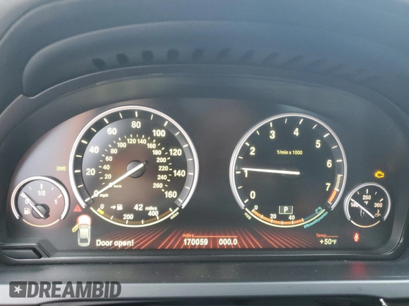2012 BMW 7 Series 740i with VIN WBAKA4C56CDS99041, listed as a Copart auction lot 41436735 with 170,059 mi miles and Clean title. Bid and sale history available at DreamBid. Image 9.