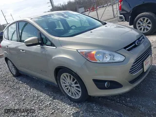 2016 Ford C-Max Energi SEL with VIN 1FADP5CU2GL113164, listed as a IAAI auction lot 41597104 with 127,008 mi miles. Bid and sale history available at carsss.com. Image 1.