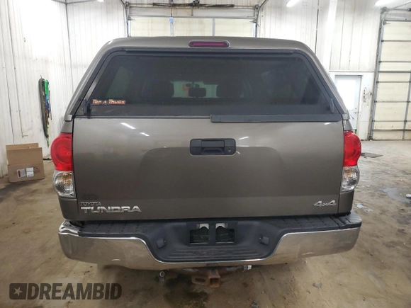 2009 Toyota Tundra z VIN 5TFBT54129X015491, wystawiony jako Copart lot #50884015 z przebiegiem 142 533 mil mil oraz Szkody całkowita. Historia ofert i sprzedaży dostępna na DreamBid. Obrazek 6.