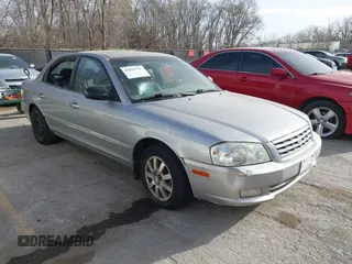 2002 Kia Optima LX z VIN KNAGD128225182377, wystawiony jako IAAI lot #41825710 z przebiegiem 214 606 mil mil oraz . Historia ofert i sprzedaży dostępna na DreamBid. Obrazek 1.