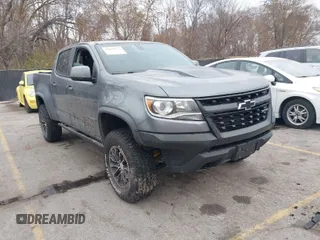 2019 Chevrolet Colorado 4WD ZR2 z VIN 1GCGTEEN5K1262858, wystawiony jako IAAI lot #41040732 z przebiegiem 89 486 mil mil oraz . Historia ofert i sprzedaży dostępna na DreamBid. Obrazek 1.