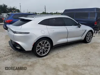 2021 Aston Martin DBX z VIN SCFVUJAW4MTV03930, wystawiony jako Copart lot #73946614 z przebiegiem Nie podano mil oraz Nie do naprawy. Historia ofert i sprzedaży dostępna na DreamBid. Obrazek 3.