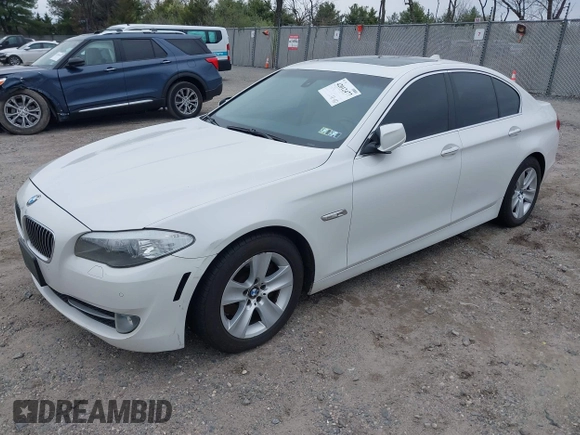 2013 BMW 5 Series 528i xDrive with VIN WBAXH5C5XDD106981, listed as a IAAI auction lot 42012477 with 140,259 mi miles. Bid and sale history available at carsss.com. Image 2.