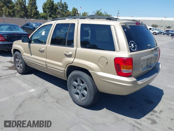 2000 Jeep Grand Cherokee Laredo z VIN 1J4G258S5YC237373, wystawiony jako IAAI lot #42736569 z przebiegiem 103 310 mil mil oraz . Historia ofert i sprzedaży dostępna na DreamBid. Obrazek 3.