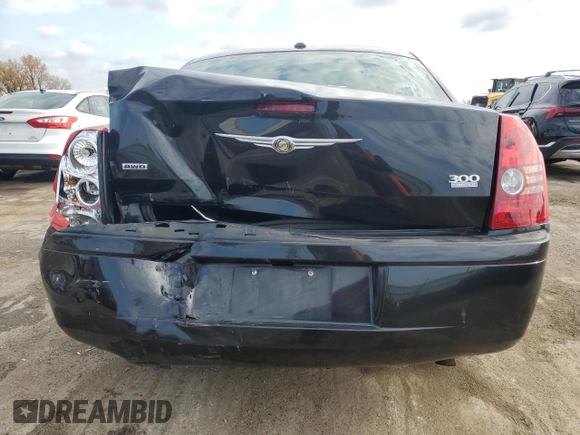 2009 Chrysler 300 with VIN 2C3LK33V19H614083, listed as a Copart auction lot 77529014 with 188,125 mi miles and Salvage title. Bid and sale history available at DreamBid. Image 6.