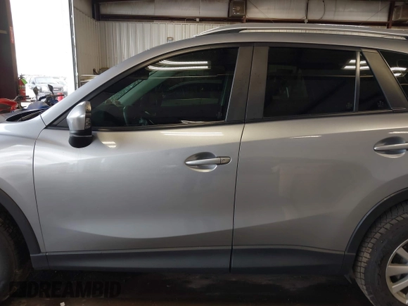 2015 Mazda CX-5 Sport z VIN JM3KE2BE8F0434889, wystawiony jako IAAI lot #42259894 z przebiegiem 298 835 mil mil oraz . Historia ofert i sprzedaży dostępna na DreamBid. Obrazek 14.