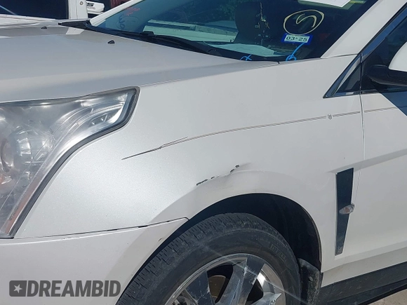 2011 Cadillac SRX Premium Collection z VIN 3GYFNCEYXBS579760, wystawiony jako IAAI lot #42238707 z przebiegiem Nie podano mil oraz . Historia ofert i sprzedaży dostępna na DreamBid. Obrazek 16.