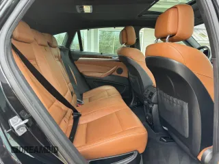 2014 BMW X6 xDrive35i z VIN 5UXFG2C57E0K41455, wystawiony jako Copart lot #58616315 z przebiegiem 162 232 mil mil oraz Tytuł czysty. Historia ofert i sprzedaży dostępna na DreamBid. Obrazek 6.