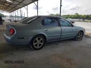 2000 Nissan Maxima GXE with VIN JN1CA31A1YT223132, listed as a Copart auction lot 60148655 with 269,258 mi miles and Salvage title. Bid and sale history available at DreamBid. Image 3.