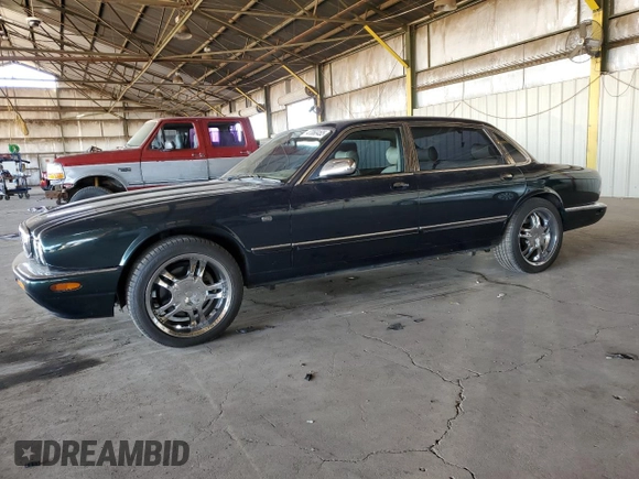 1999 Jaguar XJ with VIN SAJKX6046XC855872, listed as a Copart auction lot 47060465 with 65,286 mi miles and Clean title. Bid and sale history available at DreamBid. Image 1.