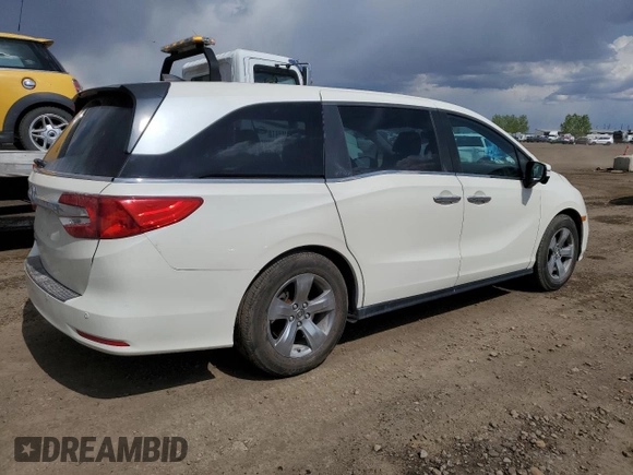 2018 Honda Odyssey EX-L z VIN 5FNRL6H68JB508942, wystawiony jako Copart lot #57323725 z przebiegiem 106 083 mil mil oraz Czysty tytuł • Clean title. Historia ofert i sprzedaży dostępna na DreamBid. Obrazek 3.