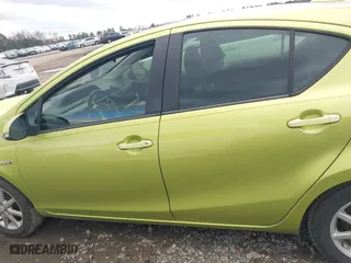 2015 Toyota Prius c One with VIN JTDKDTB36F1096872, listed as a IAAI auction lot 41202434 with 130,386 mi miles. Bid and sale history available at carsss.com. Image 14.