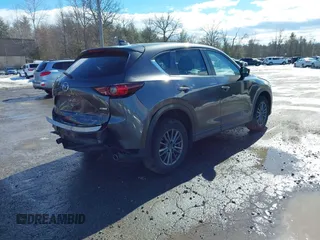 2017 Mazda CX-5 Touring with VIN JM3KFBCL3H0214881, listed as a IAAI auction lot 41694560 with 64,609 mi miles. Bid and sale history available at carsss.com. Image 4.