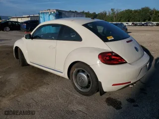 2012 Volkswagen Beetle 2.5L with VIN 3VWJX7AT1CM663786, listed as a Copart auction lot 73893424 with 34,626 mi miles and Salvage Title. Bid and sale history available at carsss.com. Image 2.