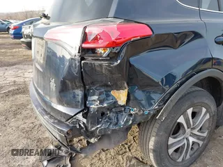 2018 Toyota RAV4 LE with VIN JTMBFREV5JD253342, listed as a IAAI auction lot 41656581 with 243,791 mi miles and . Bid and sale history available at DreamBid. Image 6.