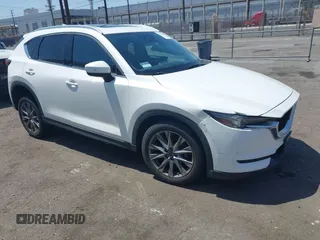 2020 Mazda CX-5 Grand Touring with VIN JM3KFADM9L0821930, listed as a IAAI auction lot 42549986 with 29,929 mi miles and . Bid and sale history available at DreamBid. Image 1.