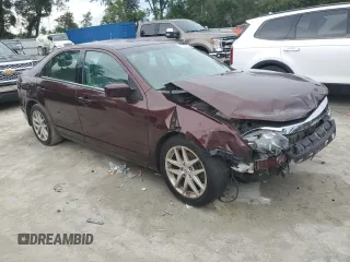 2012 Ford Fusion SEL z VIN 3FAHP0JA5CR184593, wystawiony jako Copart lot #61647265 z przebiegiem 127 720 mil mil oraz Szkoda całkowita • Salvage title. Historia ofert i sprzedaży dostępna na DreamBid. Obrazek 4.