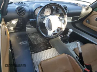 2005 Lotus Elise z VIN SCCPC11155HL34454, wystawiony jako Copart lot #82440894 z przebiegiem 29 054 mil mil oraz Szkody całkowita. Historia ofert i sprzedaży dostępna na DreamBid. Obrazek 8.