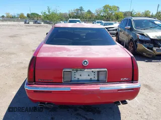 2002 Cadillac Eldorado ESC z VIN 1G6EL12Y72B102153, wystawiony jako IAAI lot #41861541 z przebiegiem 91 273 mil mil oraz . Historia ofert i sprzedaży dostępna na DreamBid. Obrazek 16.
