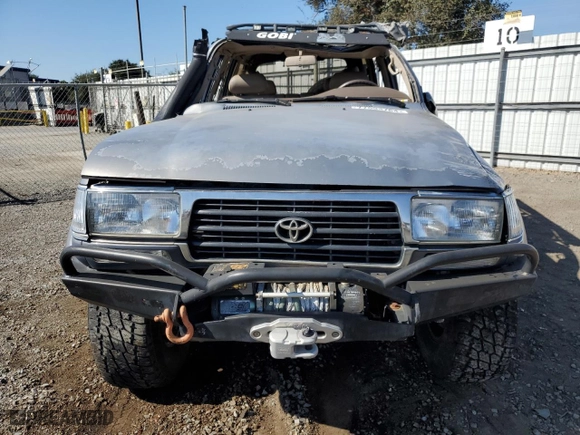 1996 Toyota Land Cruiser with VIN JT3HJ85J0T0145838, listed as a Copart auction lot 77593764 with 158,507 mi miles and Salvage Title. Bid and sale history available at carsss.com. Image 5.