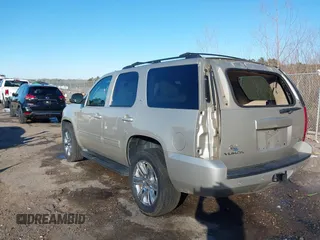 2014 GMC Yukon SLT with VIN 1GKS1CE03ER115330, listed as a IAAI auction lot 41346200 with 115,010 mi miles. Bid and sale history available at carsss.com. Image 3.